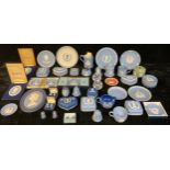 A quantity of Wedgwood commemorative Jasperware, including plates, boxes and covers, paperweights,