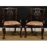 A pair of Chippendale Revival mahogany elbow chairs, 97cm high, 67cm wide, the seat 54cm wide and