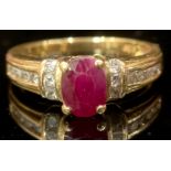 An 18ct gold ring, set with a central faceted ruby, the shoulders channel set with six vertical