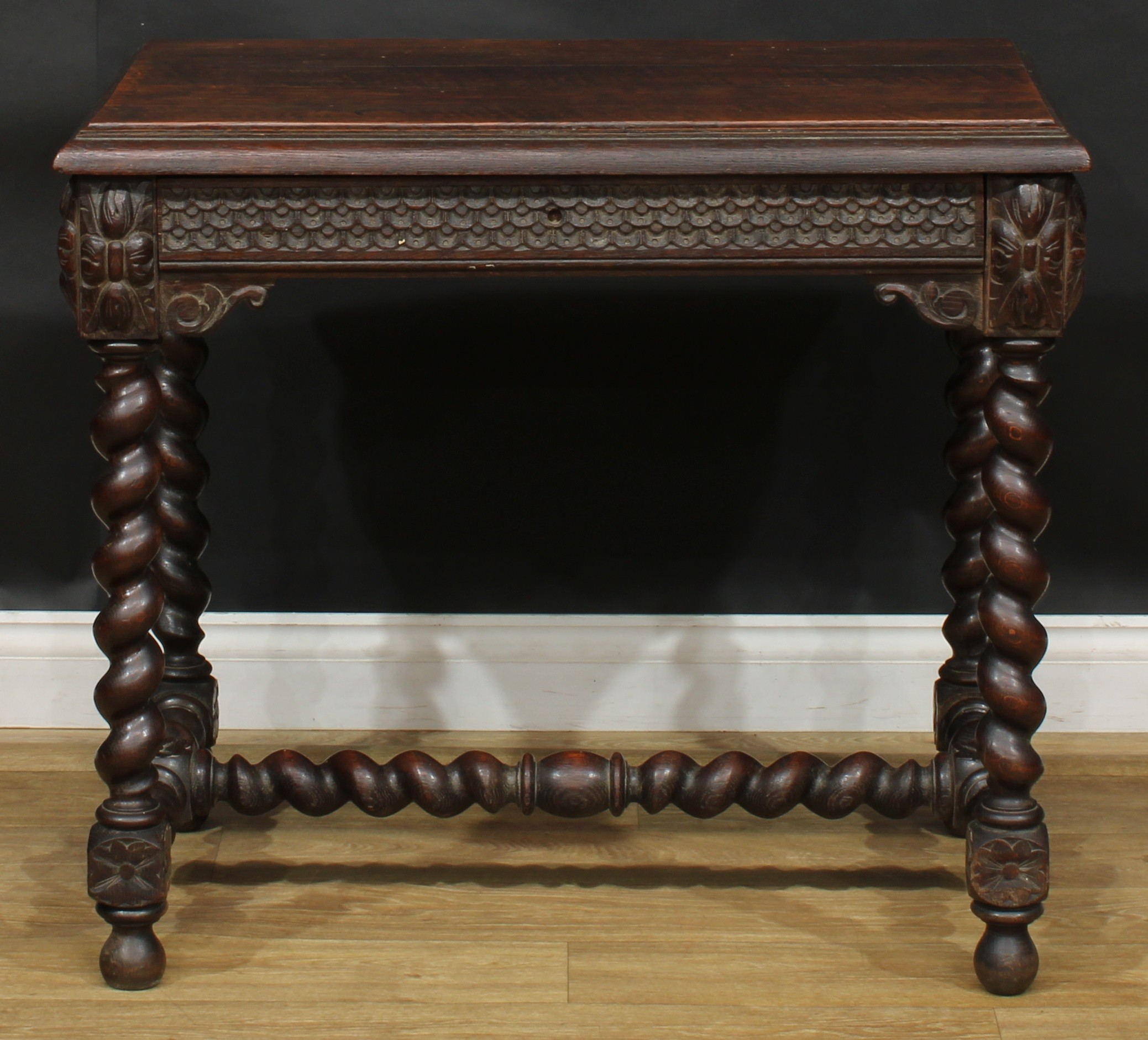 A 17th century style oak centre or side table, rectangular top with moulded edge above a long frieze