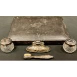 A late Victorian part silver manicure set including a pair of silver topped jars, a buffer and a