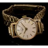 A 9ct gold lady's Longines watch, champagne dial, baton indicators, integral 9ct gold bracelet