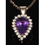A 9ct gold pear shaped amethyst pendant, surrounded by diamonds, 9ct gold necklace chain, 13g
