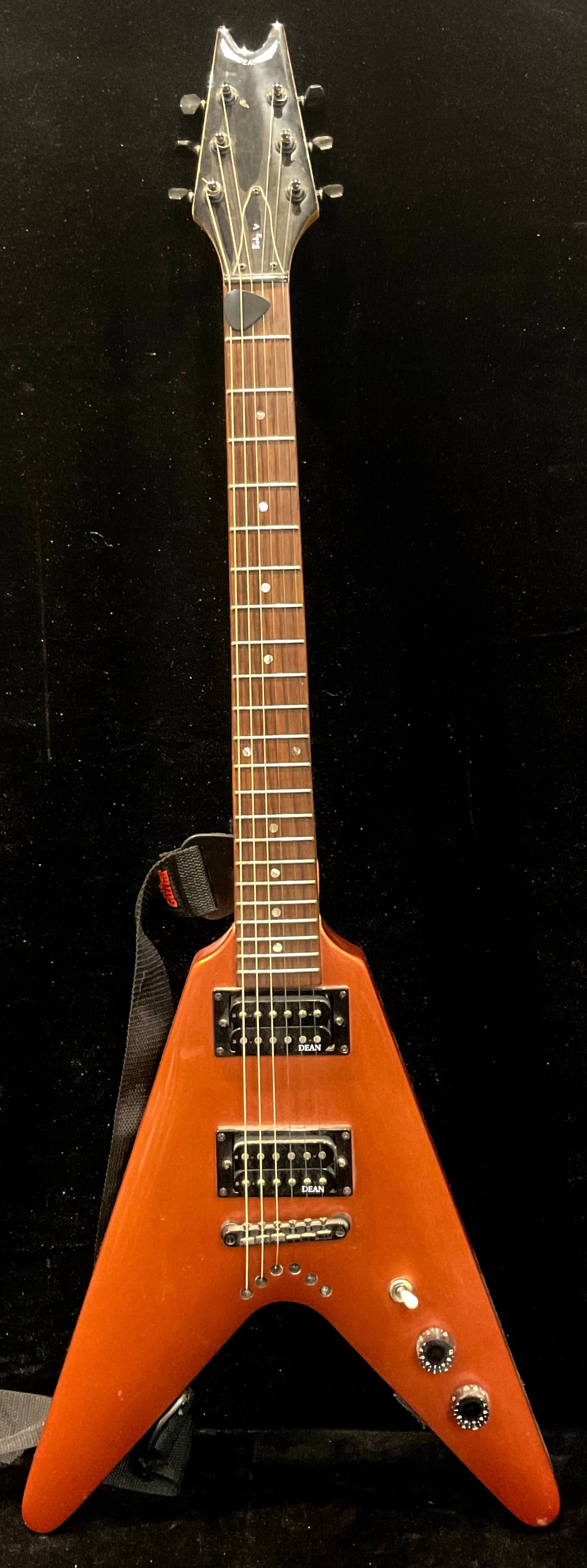 A Dean Baby V Flying V shaped guitar, Dean pickups, orange satin finish, with strap and plectrum