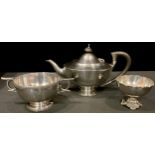 A silver tea pot, Birmingham 1918; a silver two handled bowl, cast with stiff leaves, Walker and