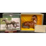 A Chinese Koji pottery model of a horse, boxed with paperwork; an Atlas Editions model of Red Rum,