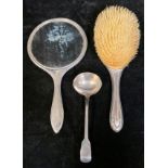 A William IV silver sauce ladle, London 1832, 50g; a George V silver hand mirror, engine turned,