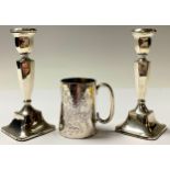 A Victorian silver christening mug, 8cm, London 1878, 99g; a pair of George V hollow filled silver