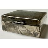 An early 20th century silver rounded rectangular cigarette box, hinged cover, cedar lined,