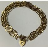 A 9ct gold gate link bracelet, love heart clasp, marked 375, 6.9g