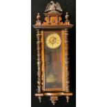 A 19th century walnut Vienna wall clock, arabic numerals, twin winding holes, 128cm high