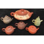 The Tea Ceremony - six Oriental teapots, various forms including red stoneware, one decorated in