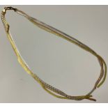 A 9ct tri-gold necklace, marked 375, 11g, boxed, faults