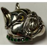 A sterling silver French Bull Dog brooch, in profile, glass eye, emerald set collar, 3cm, marked "