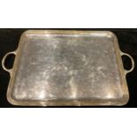 A large 19th century plated rounded rectangular two handled tray, 67cm over handles