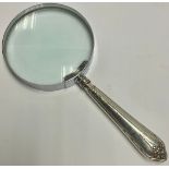 A silver hafted magnifying glass, the handle Sheffield 1924