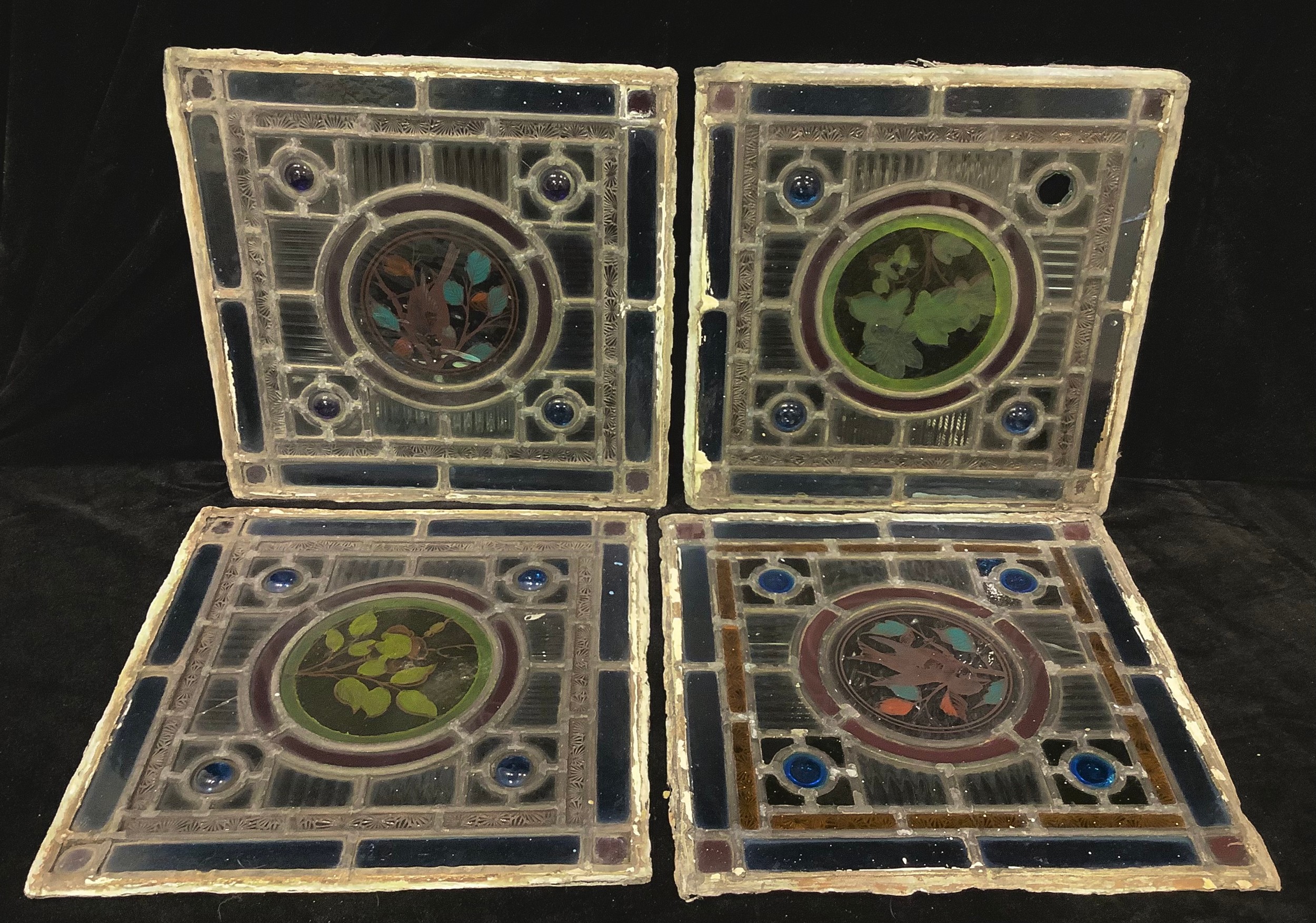 A set of four Arts and Crafts type late Victorian square stained glass window panels, two with - Image 2 of 2