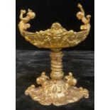 A gilt metal two handled pedestal boat shaped vase or dish, decorated in the Neoclassical style,