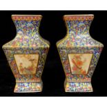 A pair of contemporary Chinese decorative waisted square vases, decorated with panels of fanciful