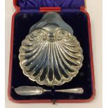 A silver scallop shell butter/preserve dish with knife, red Morocco leather case