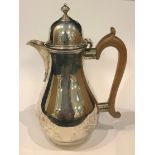 A silver chocolate jug