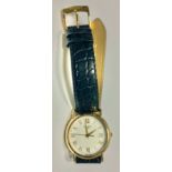 A gentleman's Tissot 18ct gold watch, white dial, Roman numerals, centre seconds, date aperture,