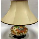 A Moorcroft Anna Lily pattern compressed ovoid table lamp, with Moorcroft lampshade, 47cm overall