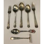 A silver fork and spoon set, Birmingham 1903; another, London 1898; a silver spoon and pusher set,