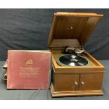 An oak HMV table top manual gramophone player, some assorted Gilbert and Sullivan and other 78s