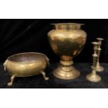 A pair of George III brass table candle sticks, circular nozzles, vasular sconces, turned columns,