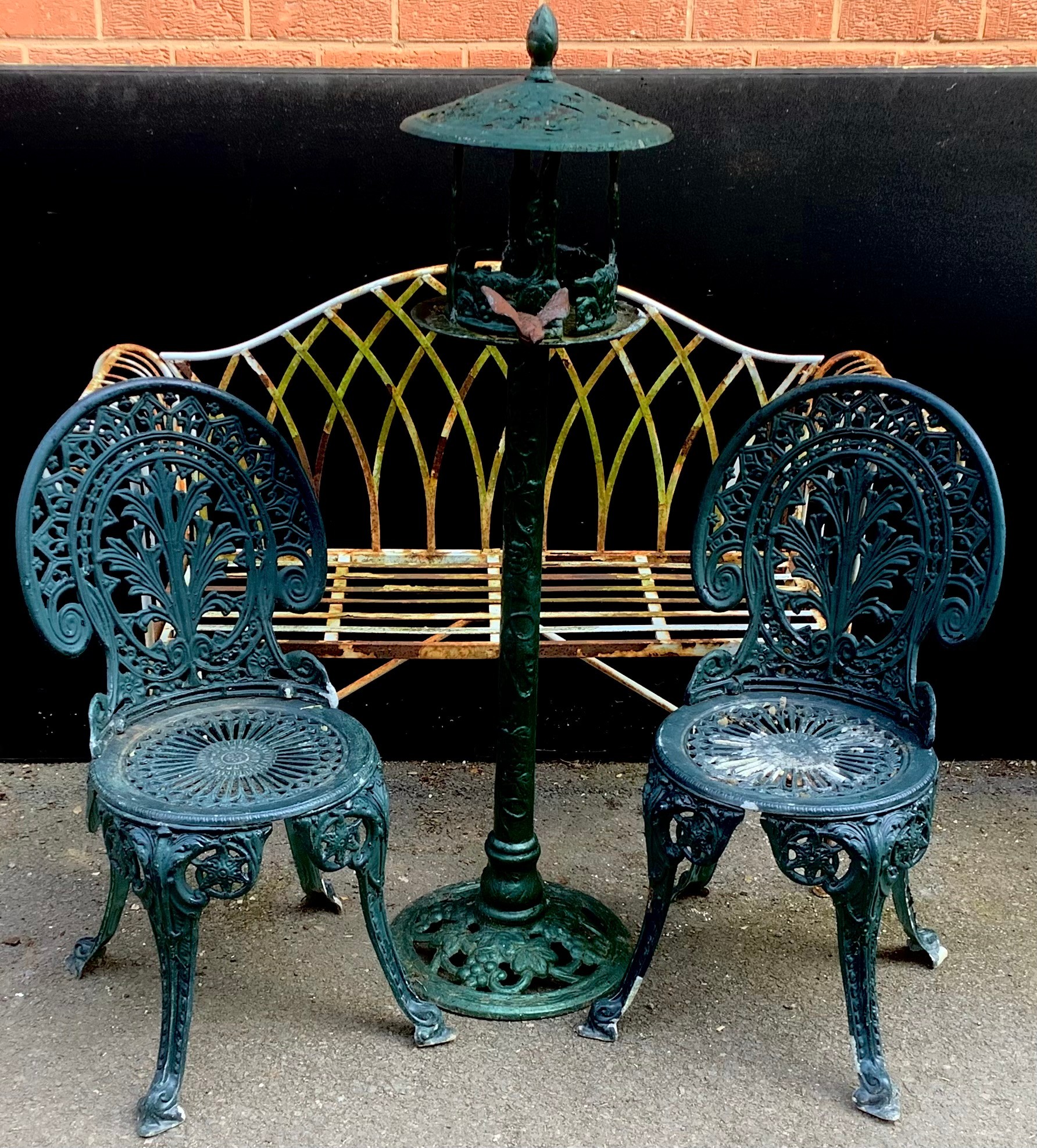 A wirework/wrought iron garden bench, 130cm wide; a pair of cast aluminum garden chairs and a