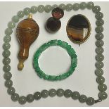 An agate brooch; a jade bracelet; a string of hardstone beads; a 19th century desk seal; a turned