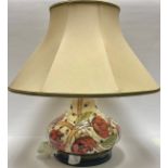 A Moorcroft Pirouette Breeze pattern compressed ovoid table lamp, with Moorcroft lampshade, 48cm