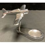 An Art Deco style chrome ashtray surmounted with a Corsair, possibly American, 13cm