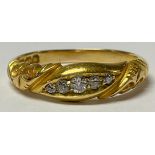 A Victorian 18ct gold five stone graduated diamond ring, size P, scroll bezel, marked 18, London