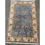 A woollen rug, blue ground 240cm x 149cm