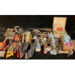 Tools - hand saws, carpentry and other tools; a cast iron shoe last; clamps; primus type stove;