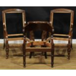 A pair of late Victorian oak library chair frames, 101cm high, 64.5cm wide; a club elbow chair