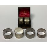 An Edward VII silver napkin ring, Chester 1908, boxed; five other silver napkin rings, 157g (6)