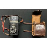 A German Voigtländer Brillant Camera with neck strap and leather carrying case marked "DRGM", post