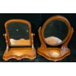 An late 19th century mahogany dressing mirror, oval frame, trinket box to stand, c.1880; another,