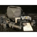 An Olympus E520 35mm camera outfit, including Olympus digital 70-300mm zoom lens 1:4 - 5.6 EDE,