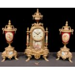 A reproduction French Empire style three piece clock garniture, the gilt brass clock with urnular