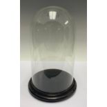 A glass display dome, the base 21cm diameter, the dome 18cm diam, 31cm high, 33.5cm high overall