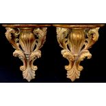 A pair of Baroque style giltwood wall brackets, 39cm high