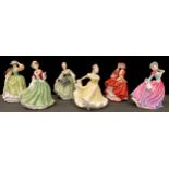 A Royal Doulton figure, Pretty Ladies, Buttercup; others, Autumn Breeze, Ninette, Top O' The Hill,