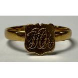 A Victorian 22ct gold signed ring, monogrammed central shield, size O, Birmingham 1867, 2.38g