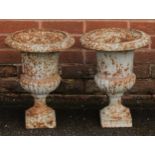 A pair of 19th century cast iron campana shaped garden urns, egg-and-dart rims, 43cm high, 33cm