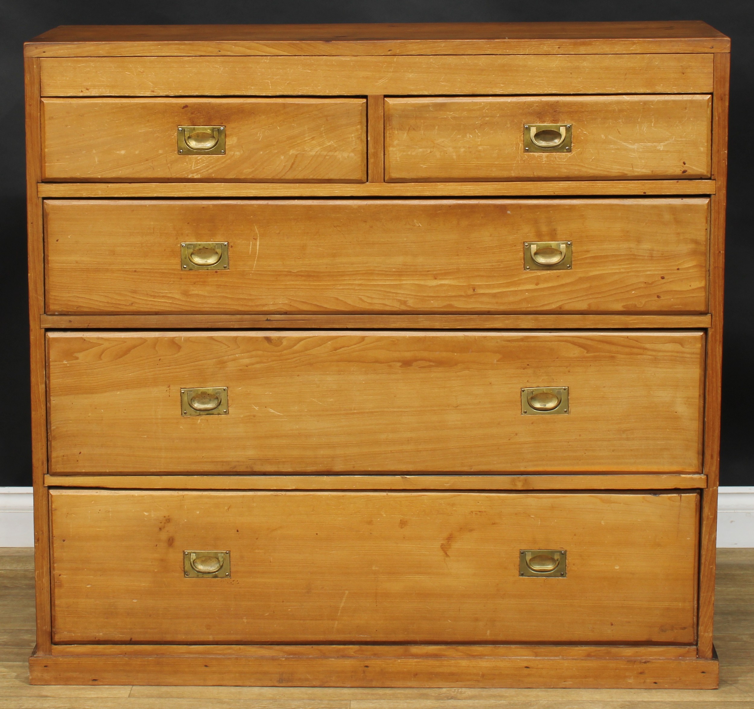 An early 20th century pine chest, of two short and three long graduated drawers, 106.5cm high, 113.