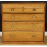 An early 20th century pine chest, of two short and three long graduated drawers, 106.5cm high, 113.